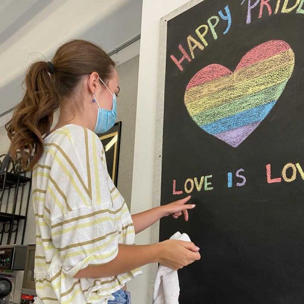 Ottawa Bike Cafe pride sign art making Elgin and Metclafe downtown Happy Pride coffee